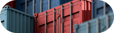 Close-up view of red and blue shipping containers stacked together